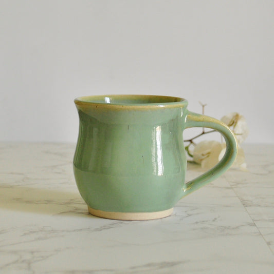 Handmade ceramic mug, with pitcher shape, made in stoneware clay and glazed in Magic Mint green glaze.